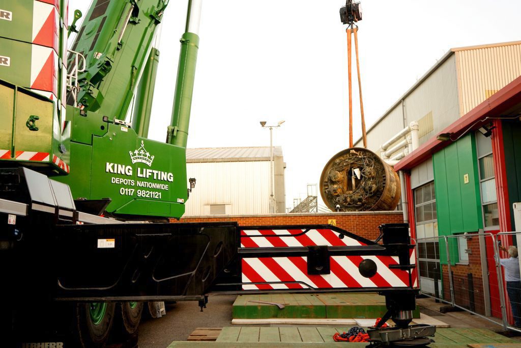 King Lifting's Liebherr LTM 1650-8.1 mobile crane moving a tunnel boring machine (TBM) from a National Grid London power tunnel shaft at its Wimbledon site in August 2022.